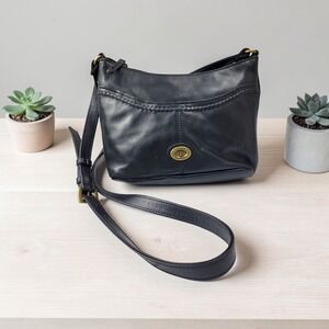 Tignanello Black Leather Crossbody Bag Brass Logo Medallion Braided Trim Zip Top